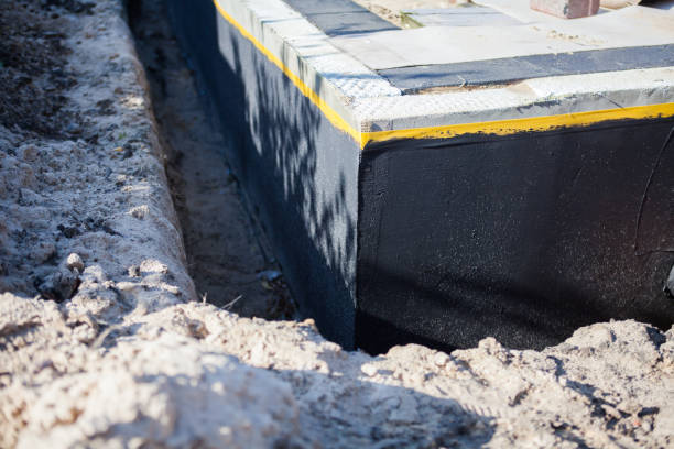 Professional Waterproofing technician working in Hopkins, MI